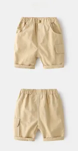 Detail of khaki boys cargo shorts with elastic waistband and large side pocket