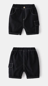 Detail of black boys' cargo shorts with contrast white stitching and elastic waist