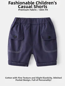 Detail of navy cotton kids shorts featuring elastic waist and large cargo pockets