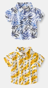 Flat lay showing detailed cotton short sleeve shirts with leaf and banana patterns