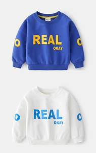 Detail of ribbed cuffs and REAL OKAY lettering on kids cotton sweatshirt