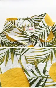 Close-up of boys tropical plant cotton linen shirt with matte buttons and collar detail