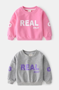 Detail of pink and grey cotton sweatshirts with logo prints and quality neck labels