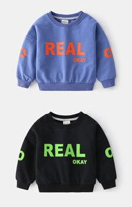 Detail of blue and black kids' cotton sweatshirts featuring vibrant graphic letter prints