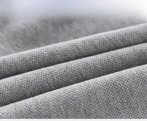 Macro shot of high-quality grey pique knit fabric for children's polo shirts
