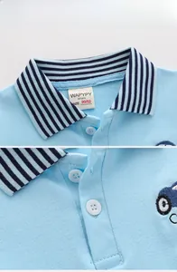 Detail of light blue cotton Polo shirt featuring striped collar and car embroidery