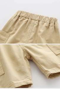 Vue détaillée du short kaki montrant la taille élastique et les coutures renforcées