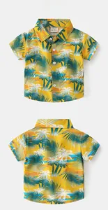 Detailed view of yellow kids Hawaiian shirt featuring tropical palm tree prints front and back