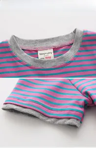 Detailed view of pink and turquoise striped cotton fabric with gray ribbed neckline