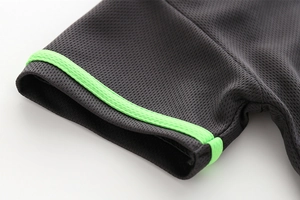 Detail of breathable mesh fabric and bright green double stripes on dark grey t-shirt sleeve