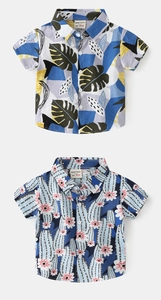 Close-up of boys short-sleeve shirts with tropical monstera and cactus floral prints