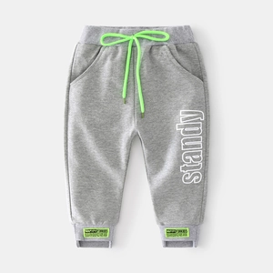 Gray kids sweatpants with green drawstring and standy side print for casual sports wear
