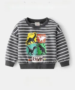 Close-up of striped kids sweatshirt with dinosaur prints in 95% cotton and 5% spandex