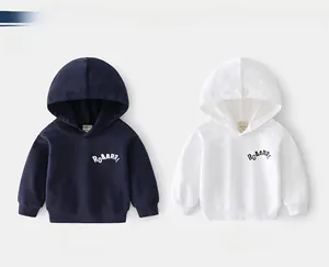 Detail of navy and white dinosaur hoodies featuring ribbed cuffs and ROAARR slogan print
