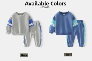 Detail view of cotton kids sports set featuring contrast side tape and elastic cuffs