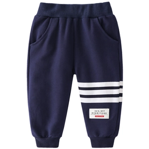Dark blue kids sports jogger with white stripes and elastic waist on white background