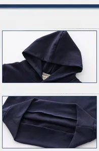 Detail of navy knit hoodie showing hooded neckline and ribbed hem for kids