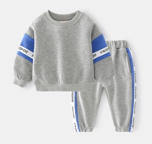Detail view of cotton grey-blue toddler tracksuit with contrast side stripes and tape