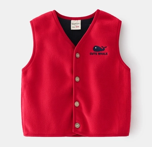 Detail of red fleece kids vest with whale embroidery and high-quality vintage buttons