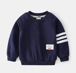 Detailed view of kids navy sweatshirt with white stripes on sleeve and a vintage patch