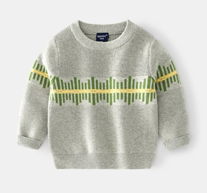 Detail of grey knitted sweater with green and yellow geometric stripes on a flat lay