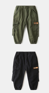 Detail of kids cargo pants with elastic waist and pocket patches in army green and black