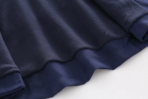 Detail of boys' winter jacket showing the warm polar fleece lining and durable outer fabric