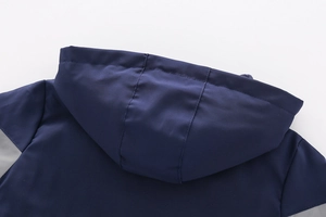 Detail view of the stitching and hood design on boys' navy blue fleece winter jacket