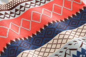 Detailed close-up of retro geometric jacquard knit pattern on kids' thick winter sweater