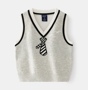 Detailed view of kids grey knit vest with striped edges and black necktie pattern