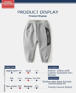 Detail of gray winter fleece joggers for kids featuring soft cotton fabric and side tape