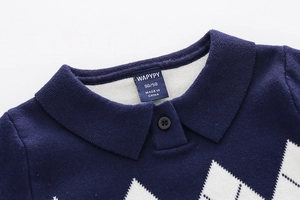 Macro detail of dark blue kids knitted polo sweater with white argyle pattern and collar