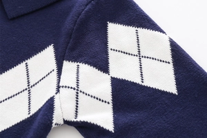 Detailed knit texture of navy blue argyle pattern cardigan with lapel collar for boys