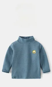 Close-up of kids warm thermal top showing gray-blue fabric and yellow lion embroidery
