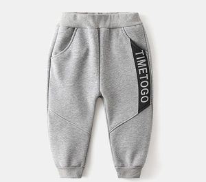 Close-up of kids grey joggers featuring elastic waistband and TIMETOGO side tape detail