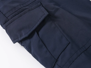 Detail of navy blue kids cargo pants with durable fabric and reinforced pocket stitching