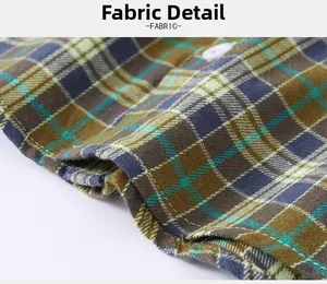 Macro view of plaid cotton fabric texture and button detail on boys casual shirt