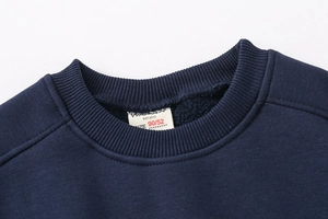 Detail of navy blue fleece sweatshirt neck with ribbed collar and size 90 label