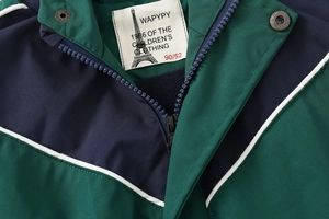 Detail of color-block kids jacket collar with metal snaps and warm fleece lining