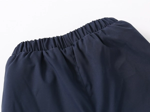 Detail of elastic waistband on navy blue winter thermal pants for kids with neat stitching
