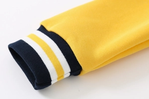 Detailed macro view of boys baseball jacket ribbed cuffs with contrast stripes