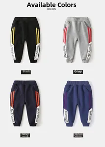 Detail showing kids thickened fleece joggers in black grey navy and blue with side print