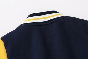 Detail of the striped baseball collar on a navy and yellow boys' thick fleece jacket