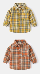 Close-up of yellow and orange plaid flannel shirts with turn-down collars and buttons