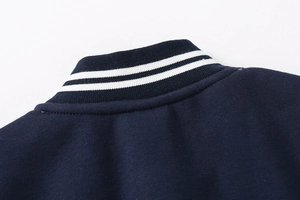 Detailed view of navy blue baseball jacket rib-knit collar with white stripes