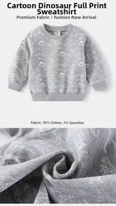 Detail of dinosaur print kids sweatshirt showing 95% cotton fabric texture and neck label
