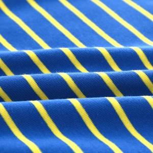 Detailed macro view of soft blue and yellow striped cotton knit fabric for children outfit