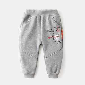 Kids warm fleece joggers with cute 3D crocodile print in light grey cotton fabric