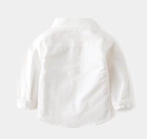 Back view of child white long-sleeved shirt showing cotton fabric texture and seams