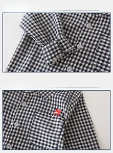 Close-up of boys long sleeve checkered shirt featuring red dinosaur embroidery detail